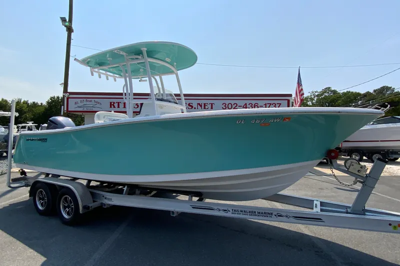 Slide: The Image of 2023 Sportsman Open 232 Center Console boat on trailer at dealership. - 2
