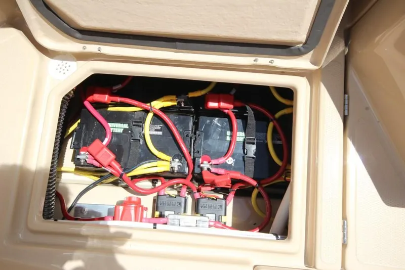 Slide: The Image of Battery compartment of a 2015 Ranger Tugs R-27 with multiple batteries and cables. - 20