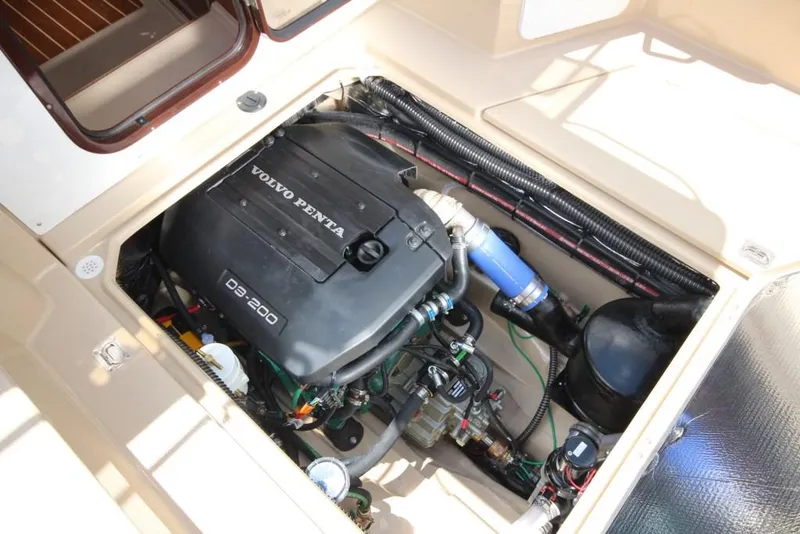 Slide: The Image of The engine compartment of a 2015 Ranger Tugs R-27 with a Volvo Penta D3-200 engine. - 21