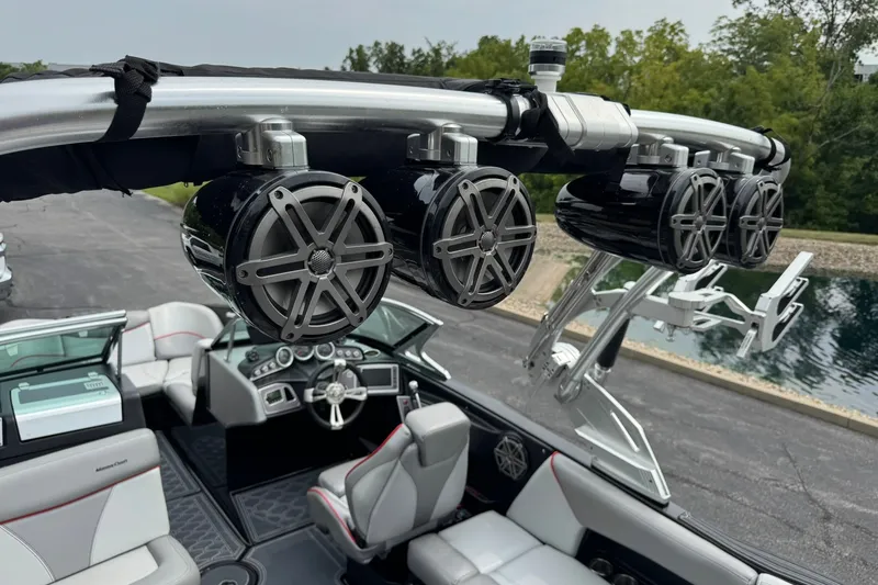 Slide: The Image of 2017 MasterCraft X23 boat interior with premium speakers and sleek dashboard design. - 14