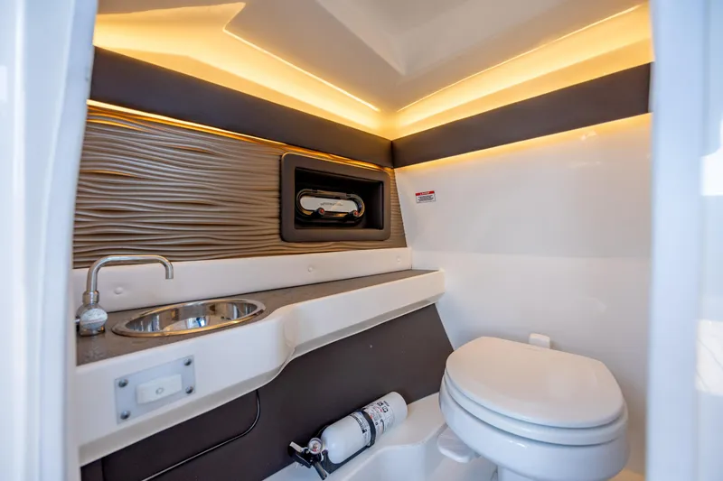 Slide: The Image of Luxurious 2022 Sea Ray SLX 280 boat bathroom with modern fixtures and ambient lighting. - 21