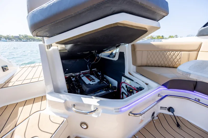 Slide: The Image of Open engine compartment of 2022 Sea Ray SLX 280 boat, showcasing interior details. - 22