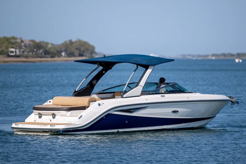 The Image of 2022 Sea Ray SLX 280 boat cruising on calm blue waters. - 0