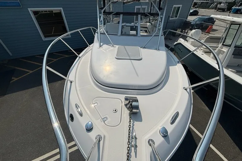 Slide: The Image of 2007 Pro-Line 29 Express boat with sleek white deck and stainless steel railings. - 17