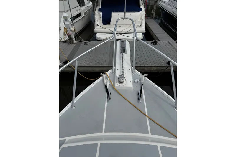 Slide: The Image of Bow view of a 2001 Willis Beal 31 boat docked at a marina. - 2