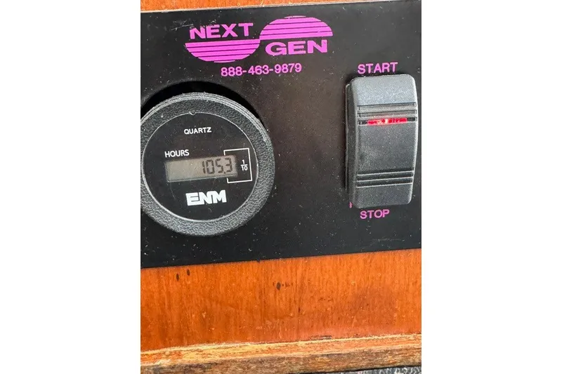 Slide: The Image of Control panel of a Willis Beal 31, 2001 model, showing 105.3 hours on quartz meter. - 23