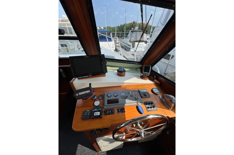 Slide: The Image of Helm of 2001 Willis Beal 31 boat with navigation equipment and wooden dashboard. - 13