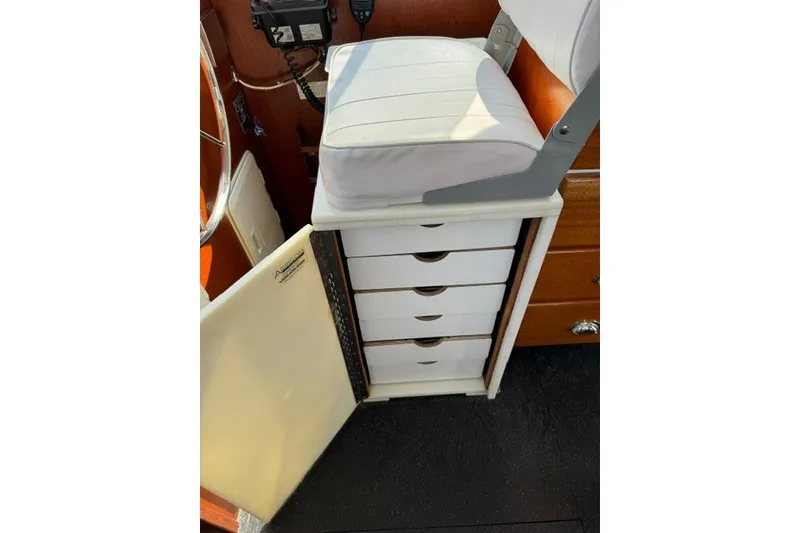 Slide: The Image of Interior of a 2001 Willis Beal 31 boat showing storage drawers and seating. - 12