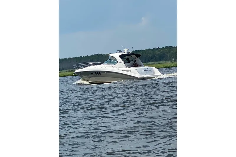 The Image of 2004 Sea Ray 380 Sundancer cruising on a scenic waterway. - 0