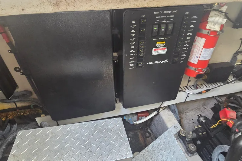 Slide: The Image of Electrical panel and fire extinguisher in 2004 Sea Ray 380 Sundancer boat. - 14