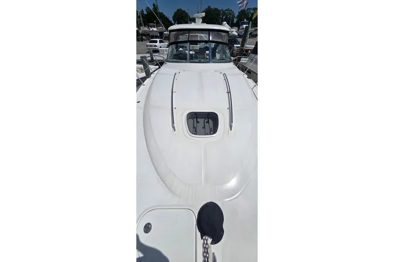 Slide: The Image of 2004 Sea Ray 380 Sundancer yacht deck view, showcasing sleek design and spacious layout. - 3