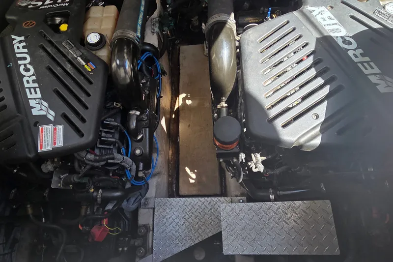 Slide: The Image of Engine compartment of a 2004 Sea Ray 380 Sundancer with Mercury engines. - 15