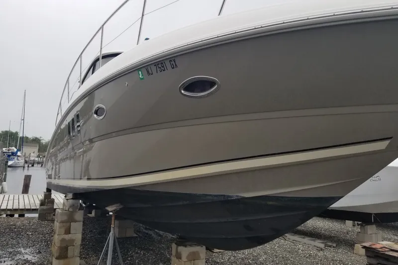 Slide: The Image of 2004 Sea Ray 380 Sundancer yacht on dry dock, side view. - 5