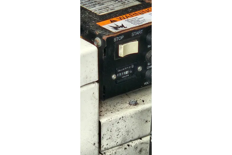 Slide: The Image of Control panel of a 2004 Sea Ray 380 Sundancer boat with start-stop switch. - 12