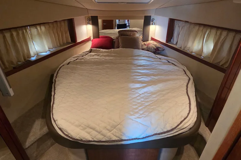 Slide: The Image of Luxurious cabin interior of 2004 Sea Ray 380 Sundancer yacht with cozy bedding. - 20