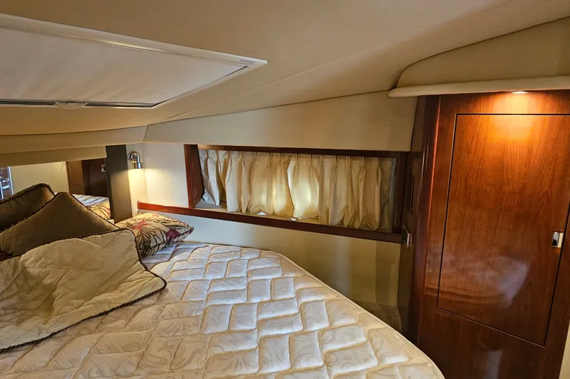 Slide: The Image of Luxurious cabin interior of 2004 Sea Ray 380 Sundancer yacht with cozy bedding. - 7