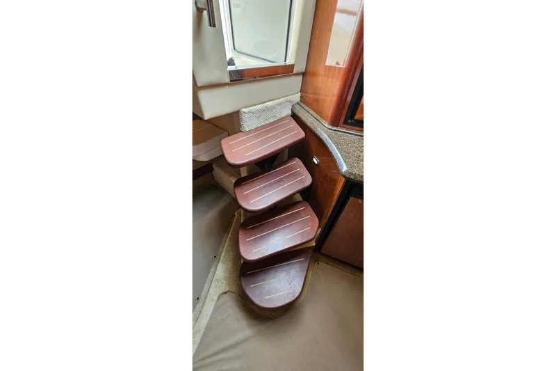 Slide: The Image of Wooden interior steps on a 2004 Sea Ray 380 Sundancer yacht. - 11