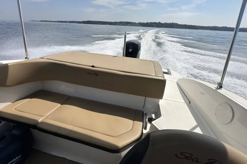 Slide: The Image of 2020 Sea Ray SPX 190 Outboard cruising on open water, showcasing comfortable seating. - 2