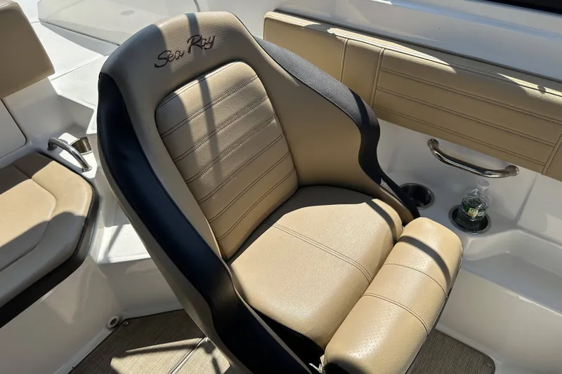 Slide: The Image of Captain's seat on a 2020 Sea Ray SPX 190 Outboard boat, featuring tan upholstery. - 9