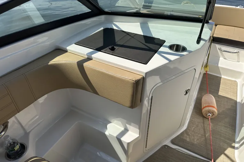 Slide: The Image of Interior view of a 2020 Sea Ray SPX 190 Outboard boat with seating and storage. - 5