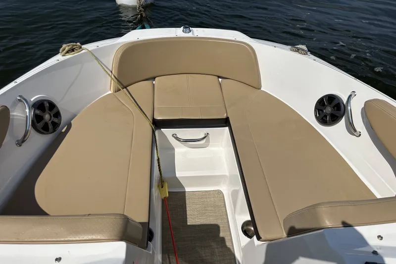Slide: The Image of Bow seating area of 2020 Sea Ray SPX 190 Outboard with beige cushions. - 3