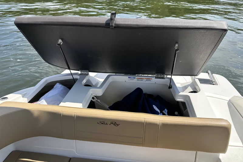 Slide: The Image of 2020 Sea Ray SPX 190 Outboard boat with open storage compartment on the water. - 4