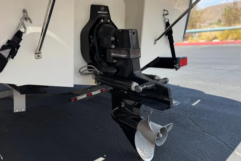Slide: The Image of Rear view of a 2019 Bayliner 195 Deck Boat with MerCruiser engine. - 8