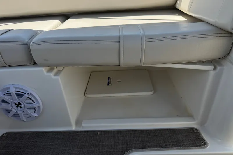 Slide: The Image of Interior of 2019 Bayliner 195 Deck Boat showing seating and storage compartment. - 24