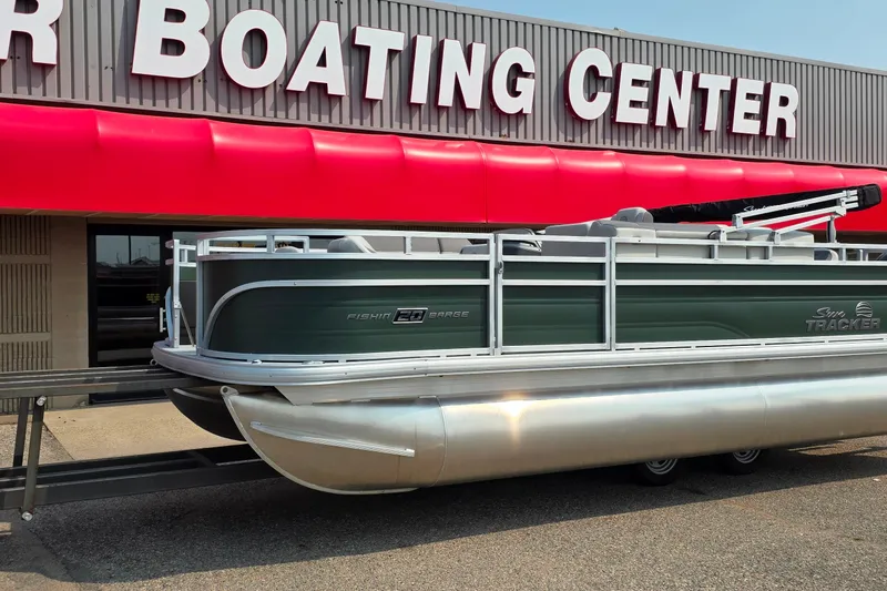 The Image of 2027 Sun Tracker Fishin' Barge 20 DLX pontoon boat at a boating center. - 0