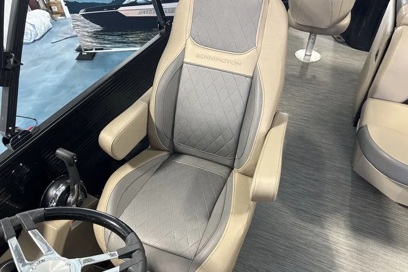 Slide: The Image of Captain's chair in 2022 Bennington 25 LSAPG boat with elegant upholstery design. - 13