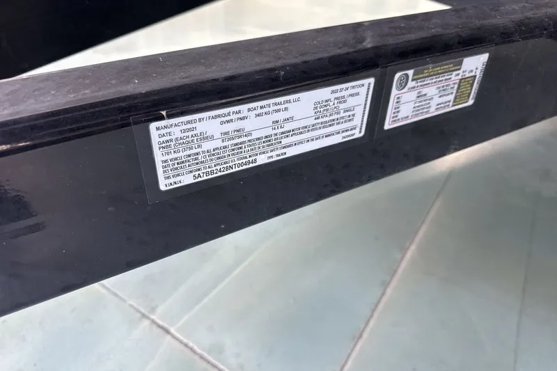 Slide: The Image of Label on a 2022 Bennington 25 LSAPG boat trailer, showing specifications and VIN. - 27