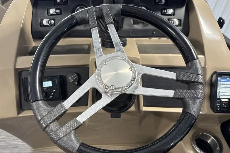 Slide: The Image of Steering wheel of 2022 Bennington 25 LSAPG boat with control panel and Garmin display. - 14