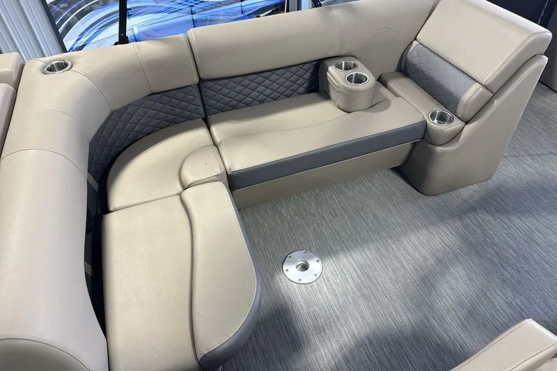 Slide: The Image of Luxurious seating area on a 2022 Bennington 25 LSAPG pontoon boat with cup holders. - 10