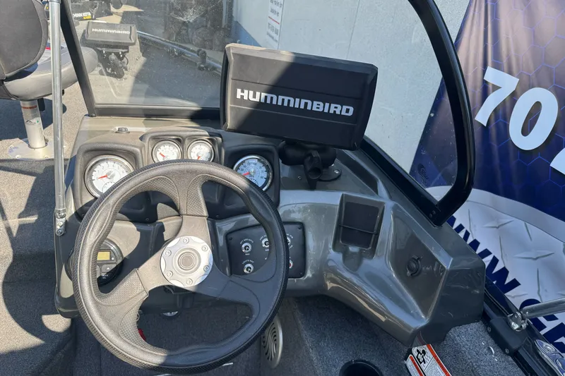 Slide: The Image of 2021 Tracker Pro Guide V-175 Combo dashboard with steering wheel and Humminbird display. - 16