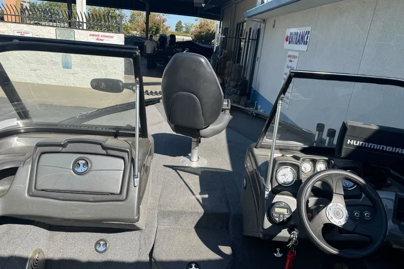Slide: The Image of Interior view of a 2021 Tracker Pro Guide V-175 Combo boat with steering wheel and dashboard. - 15