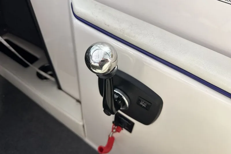 Slide: The Image of 2016 Moomba Mojo boat throttle control with chrome handle and safety lanyard. - 16