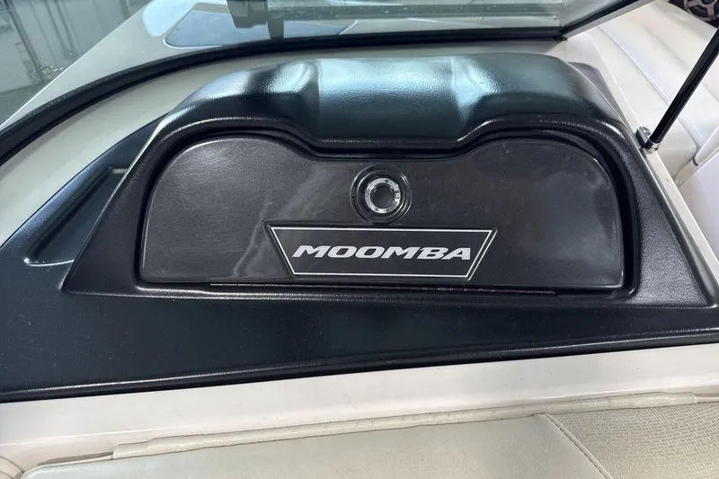 Slide: The Image of 2016 Moomba Mojo dashboard with logo, featuring sleek black design. - 18