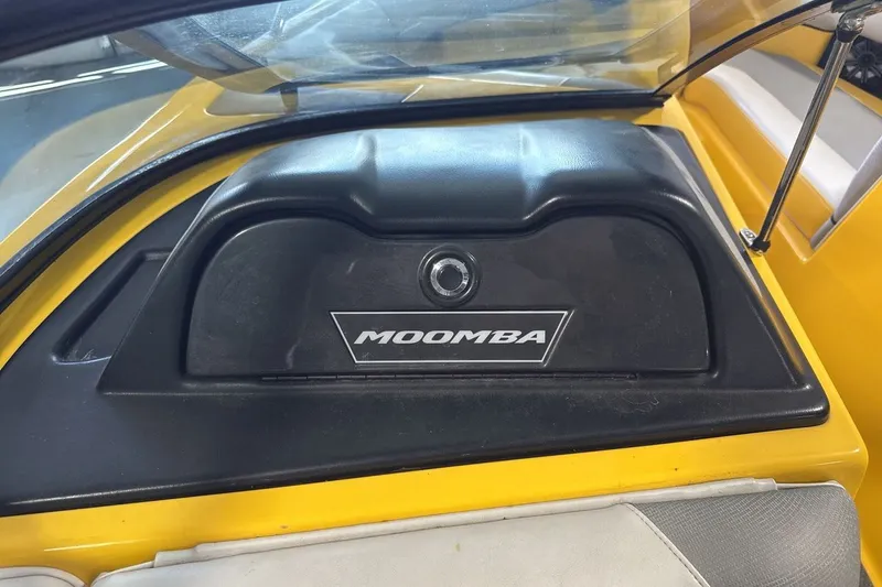 Slide: The Image of 2016 Moomba Mondo boat dashboard with black cover and logo. - 18