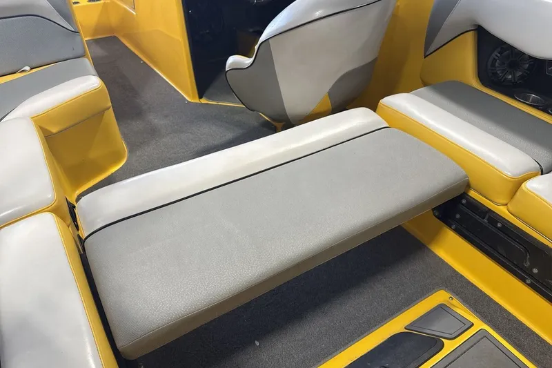 Slide: The Image of 2016 Moomba Mondo boat interior with yellow and gray seating arrangement. - 23