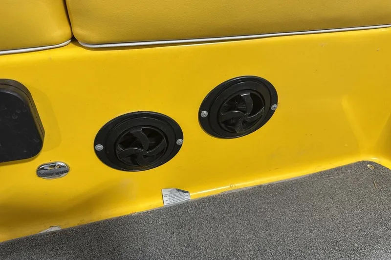 Slide: The Image of Yellow interior of a 2016 Moomba Mondo boat with black speaker vents. - 24