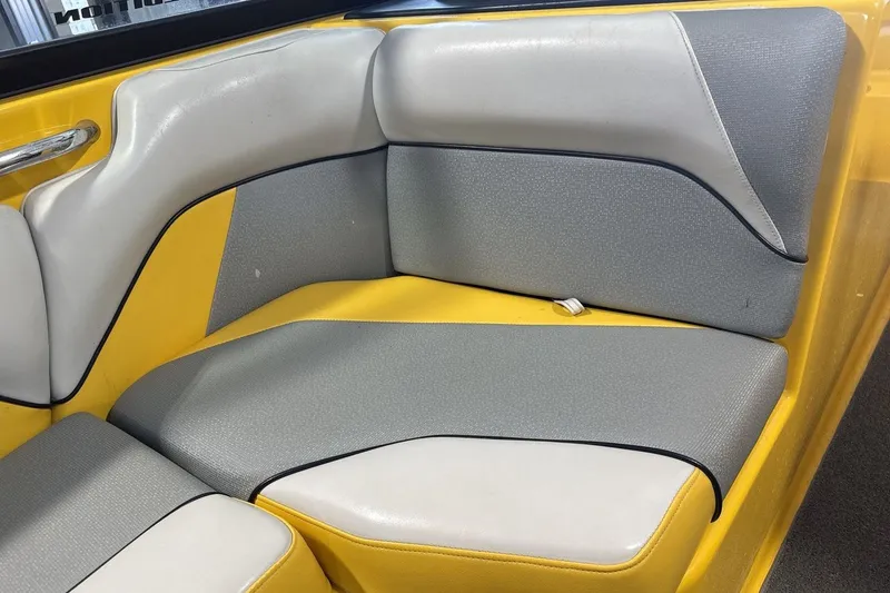 Slide: The Image of 2016 Moomba Mondo boat interior with yellow and gray seating. - 17