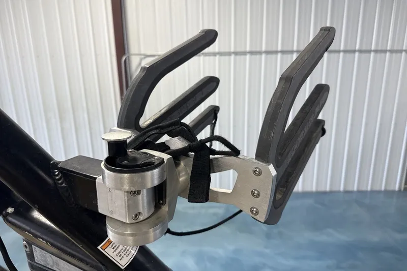 Slide: The Image of 2016 Moomba Mondo boat accessory, featuring a metal and rubber wakeboard rack. - 21