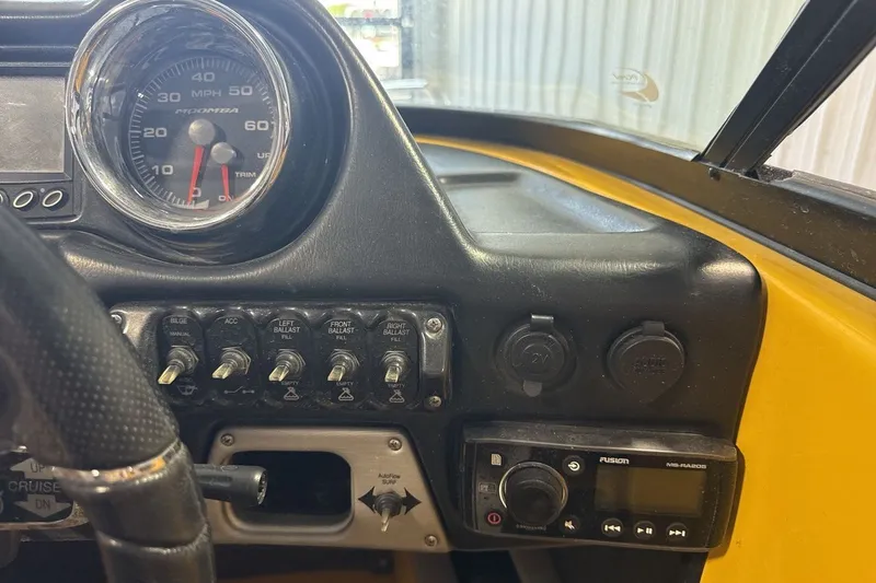 Slide: The Image of 2016 Moomba Mondo dashboard with speedometer, switches, and audio controls. - 15