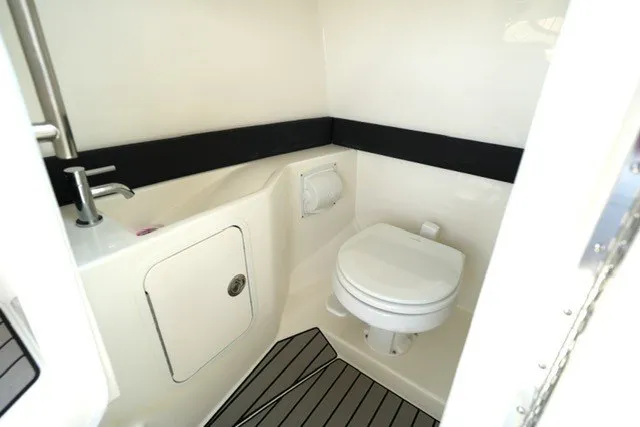 Slide: The Image of 2027 Sea Ray SLX 280 boat bathroom with modern fixtures and sleek design. - 16