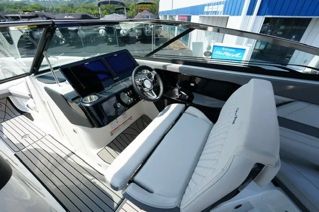 Slide: The Image of 2027 Sea Ray SLX 280 boat interior with modern dashboard and seating. - 13