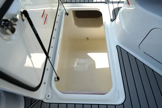 Slide: The Image of Open storage compartment on 2027 Sea Ray SLX 280 boat deck. - 19
