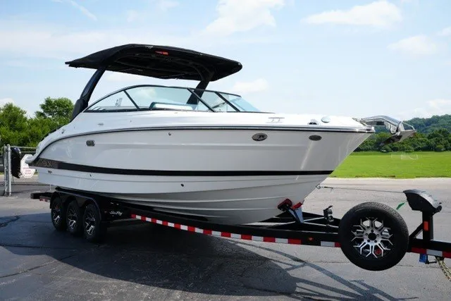 Slide: The Image of 2027 Sea Ray SLX 280 boat on trailer, sleek design, parked outdoors. - 3