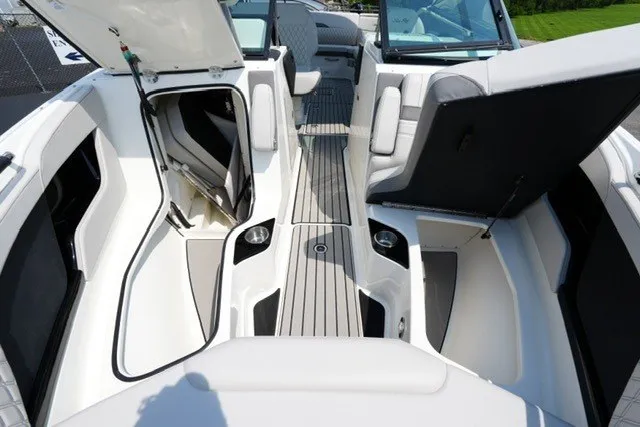 Slide: The Image of 2027 Sea Ray SLX 280 boat interior with open storage compartments and sleek seating design. - 10