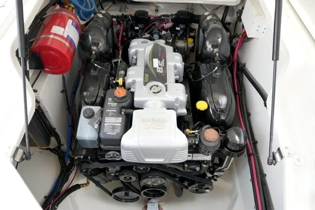 Slide: The Image of Engine compartment of a 2027 Sea Ray SLX 280 boat, featuring a powerful inboard motor. - 23