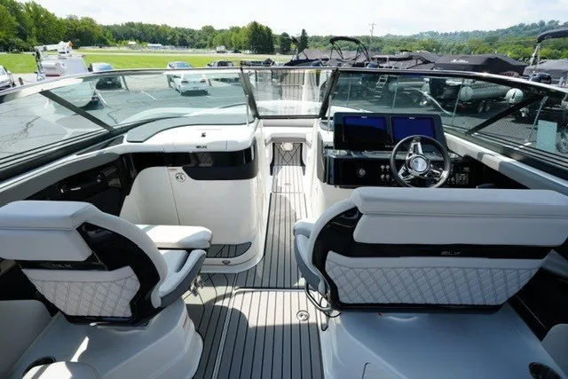 Slide: The Image of 2027 Sea Ray SLX 280 boat interior with modern helm and seating. - 12